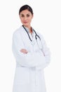 Female doctor standing with her arms folded Royalty Free Stock Photo