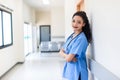 Female doctor stands at hospital. Healthcare worker. woman pharmacist with and stethoscope smiling satisfied with her job in hospi Royalty Free Stock Photo