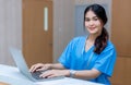 Female doctor stands at hospital. Healthcare worker. woman pharmacist with and stethoscope smiling satisfied with her job in hospi Royalty Free Stock Photo