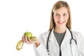 Female Doctor With Stethoscope Holding Smith Apple And Tape Meas Royalty Free Stock Photo