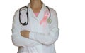 Female doctor with stethoscope and pink ribbon, isolated Health care, medical breast cancer awareness concept Royalty Free Stock Photo