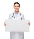 Female doctor with stethoscope and white board Royalty Free Stock Photo