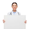 Female doctor with stethoscope and white board Royalty Free Stock Photo