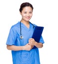 Female doctor with surgery gown and clipboard Royalty Free Stock Photo