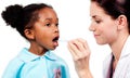 Female doctor taking little girl's temperature Royalty Free Stock Photo