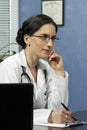 Female doctor taking notes