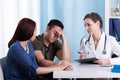 Female doctor talking with her patients