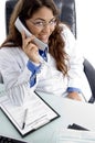 Female doctor talking on phone Royalty Free Stock Photo