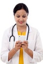 Female doctor text messaging