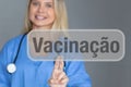 Female doctor touching screen with brazilian and portuguese word for vaccination Royalty Free Stock Photo