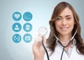 Female doctor touching stethoscope on digitally generated medical icons against white background Royalty Free Stock Photo
