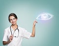 Female doctor in uniform touch painted human eye Royalty Free Stock Photo