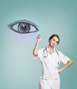 Female doctor in uniform touch painted human eye Royalty Free Stock Photo