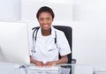 Female Doctor Using Computer At Desk In Hospital Royalty Free Stock Photo