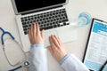 Female doctor using computer at workplace. Health care concept Royalty Free Stock Photo