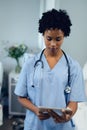 Female doctor using digital tablet in the ward at hospital Royalty Free Stock Photo