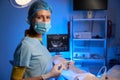 Female doctor using syringe for artificial fertilization in reproductive clinic