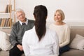 Female Doctor Visiting Senior Couple, Talking To Them Royalty Free Stock Photo