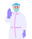 Female doctor wearing personal protective equipment PPE suit, face mask and showing stop sign. Physician or surgeon gesturing Royalty Free Stock Photo