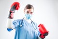 Female doctor wearing red boxing gloves Royalty Free Stock Photo