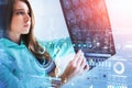 Female doctor wearing teal suit looking at radiograph of skull