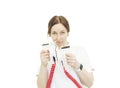 female doctor in a white coat with a defibrillator in her hands is preparing to resuscitate cut out on a white background