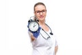 Female doctor in white coat he holds watch in his hand. Time to take care of your health. Isolated on white background Royalty Free Stock Photo