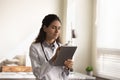 Female doctor work on modern tablet in clinic Royalty Free Stock Photo