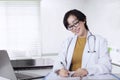 Female doctor working in the clinic room Royalty Free Stock Photo