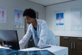 Female doctor working on computer at desk in the hospital Royalty Free Stock Photo