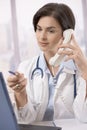 Female doctor working at desk Royalty Free Stock Photo