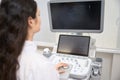 Female doctor working on equipment in the clinic Royalty Free Stock Photo