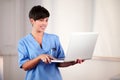 Female doctor working on her laptop Royalty Free Stock Photo