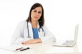 Female doctor working on medical expertise and searching information on laptop at hospital office Royalty Free Stock Photo