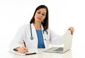 Female doctor working on medical expertise and searching information on laptop at hospital office Royalty Free Stock Photo