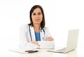 Female doctor working on medical expertise and searching information on laptop at hospital office Royalty Free Stock Photo