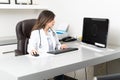 Female Doctor Working In Office