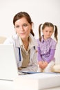 Female doctor write prescription for child