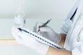 Female doctor writing medical information in notebook at hospital Royalty Free Stock Photo