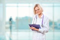 Female doctor writng in clipboard Royalty Free Stock Photo