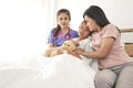 Doctor and child with mother in hospital