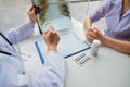 Female doctors, specialists in treatment, make an appointment to meet patients after x-ray and give advice, explain medical Royalty Free Stock Photo