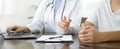 Female doctors who treat patients make an appointment to listen to the results after a physical examination and explain medical