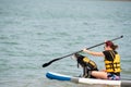 Female with a dog on the paddle board Royalty Free Stock Photo