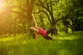 Female doing yoga asana side plank pose with bent leg. Royalty Free Stock Photo