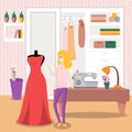 Female dressmaker sewing elegant red dress for her customer