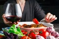 Female drink red wine and eating roiast chicken Royalty Free Stock Photo