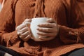 Female drinking coffee in a cold autumnal morning Royalty Free Stock Photo