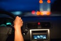 Female drive driving a car at night Royalty Free Stock Photo