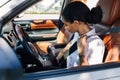 Female driver buckling safety belt Royalty Free Stock Photo